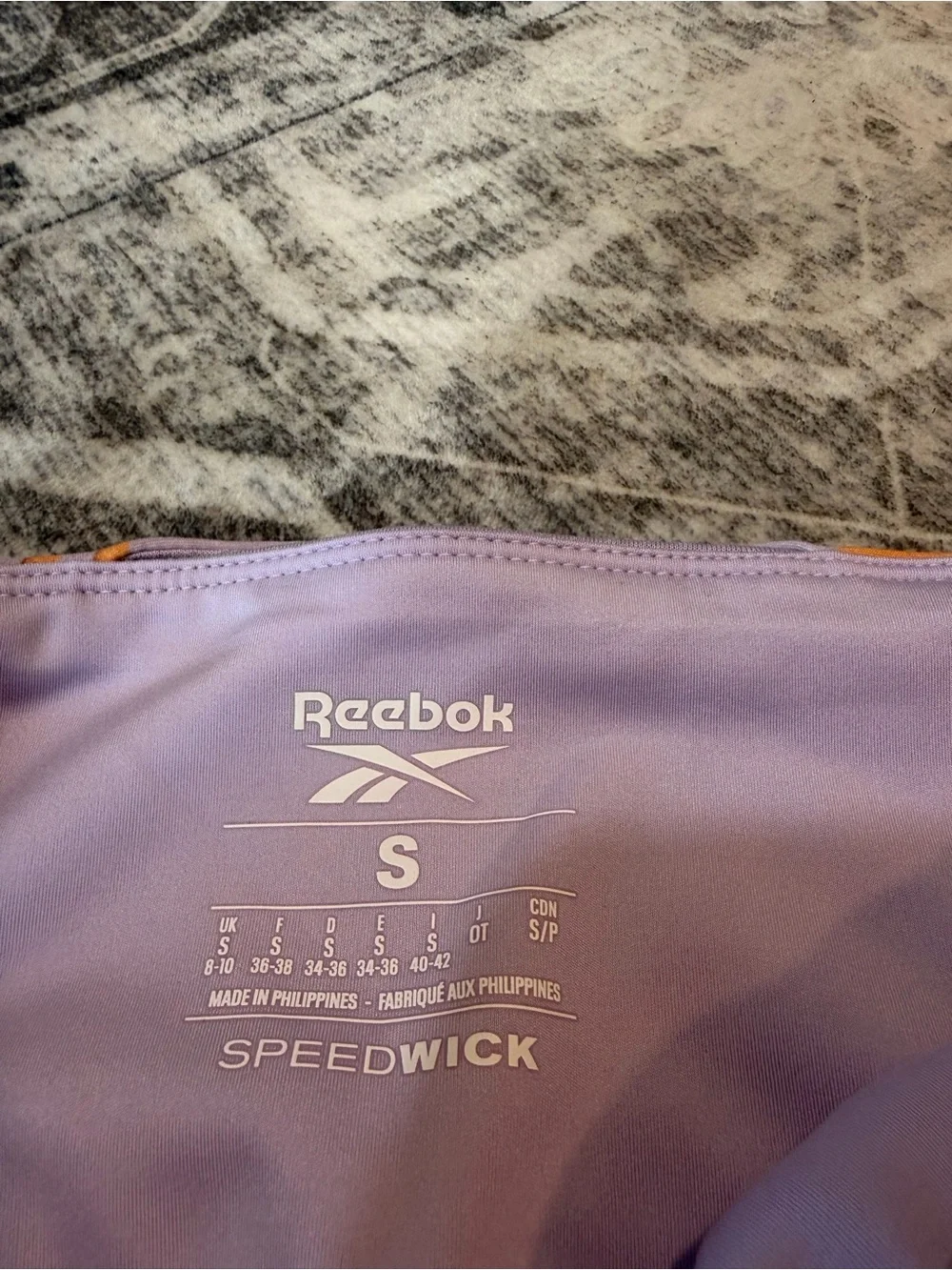 Reebok Lavender and Orange Graphic High-Rise Leggings with matching sports bra